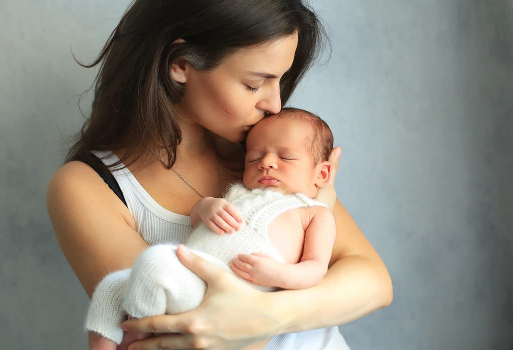 kissing newborn