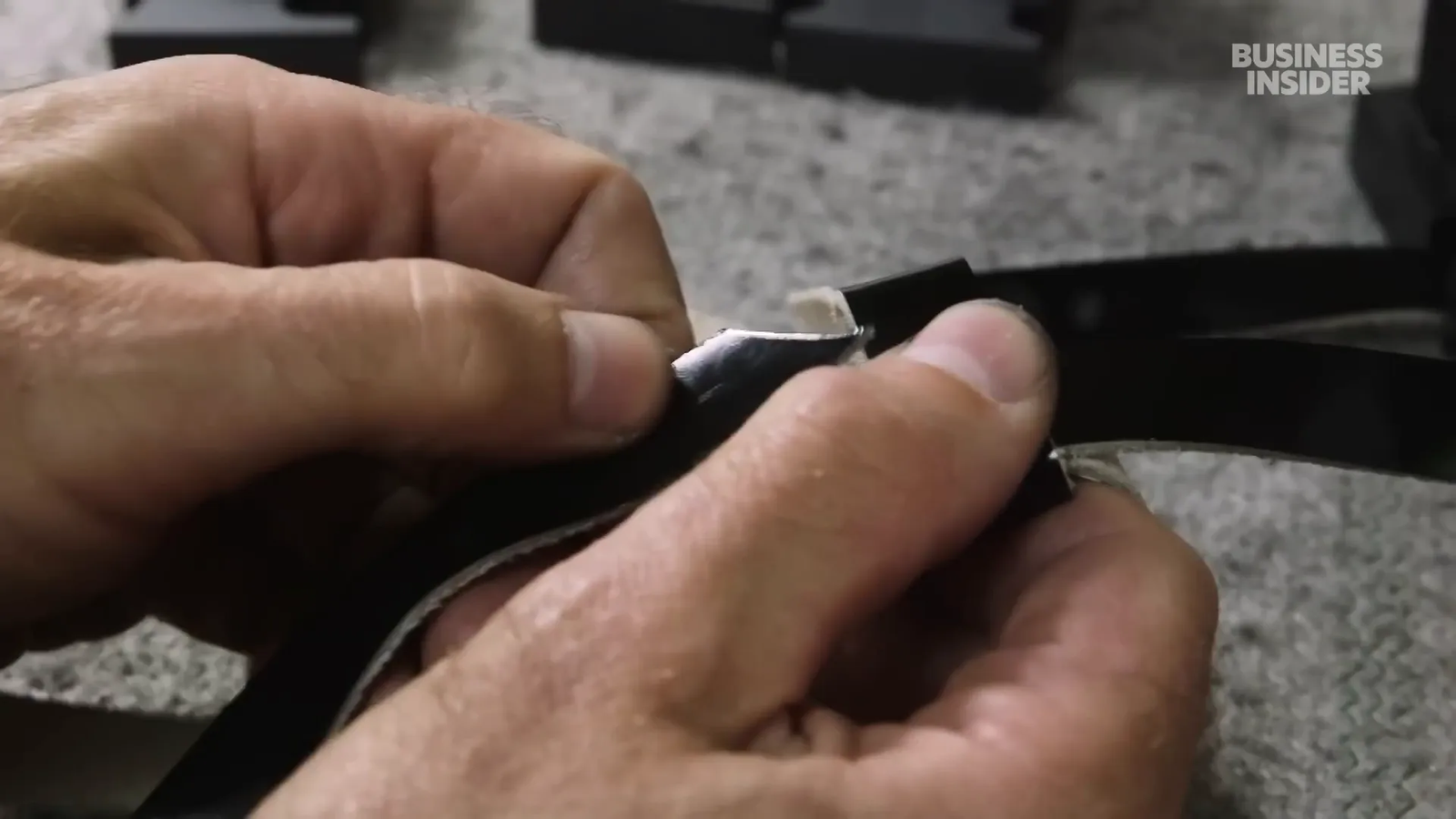 Jewish man putting on Tefillin